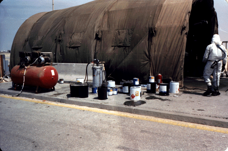 Figure 8. Painter wearing an air-supplied respirator