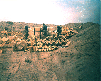 Figure 30. Soldiers preparing munitions for demolition in a revetment; picture courtesy of Commander, 207th Engineer Battalion