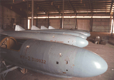 Figure 6. Photograph of six SILKWORM missiles captured at the Kuwaiti Girls' School awaiting transport to the US. Note the serial number on the first missile matches that of the missile at the Girls' School in Figure 4.