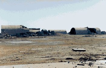 Figure 5. Bomb damaged hardened aircraft shelters