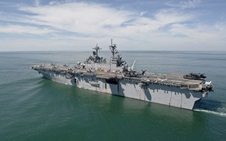 MH-60S Sea Hawk helicopters and MH-53 Sea Dragon helicopters prepare to launch from the amphibious assault ship USS Wasp. Wasp is returning to Norfolk after standing by to provide assistance to areas affected by Hurricane Irene.