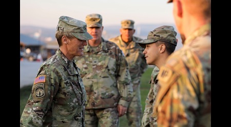 The Adjutant General of Colorado, U.S. Army Brig. Gen. Laura Clellan, speaks with U.S. Army Sgt. Antonio Rodriguez, Military Working Dog (MWD) NCOIC and Handler, 100th MWD Det., while visiting Colorado National Guard Soldiers deployed to Kosovo as part of KFOR Regional Command-East’s Task Force Alpine, Camp Bondsteel, Kosovo, October 19, 2021.