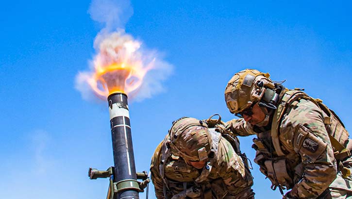 Image of Army Col. Randy Lau fires a 120 mm mortar during a live-fire exercise at Camp Roberts, California, June 15, 2021.