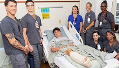 Boy who suffered shark attack is surrounded by his team of health care professionals at Naval Medical Center Camp Lejeune.