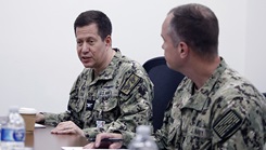 Military personnel at a meeting