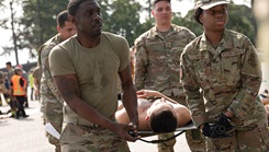 Airmen from the 628th Medical Group carry a patient during a medical exercise