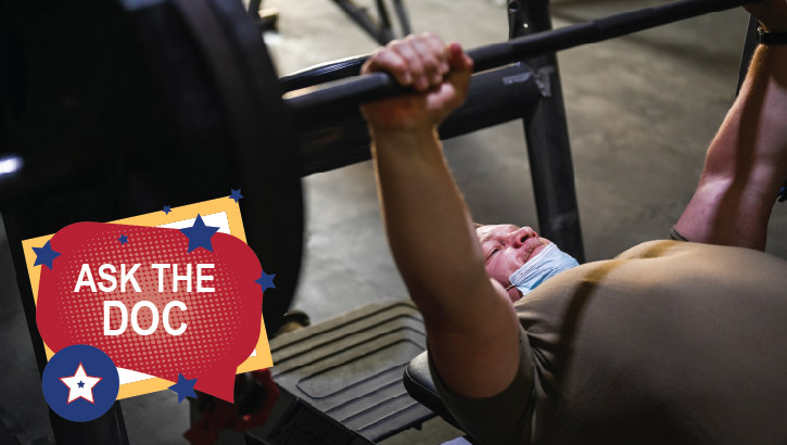 Image of Senior Airman Thomas McMurray with the 387th Expeditionary Support Squadron Force Protection prepares for a bench press at Al Mubarak Air Base, Kuwait, May 13, 2021 .