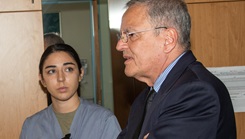 The Honorable Dr. Lester Martinez-Lopez (left), Assistant Secretary of Defense for Health Affairs (ASD for Health Affairs), visits with volunteers at Landstuhl Regional Medical Center (LRMC), during a tour of the hospital with Col. Theodore Brown, LRMC commander, as part of a larger visit to Europe, July 10, 2023. (U.S. Army Photo by William Beach) 