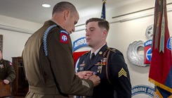 U.S. Army Sgt. Brian Lieberman, a Paratrooper assigned to 1st Brigade Combat Team, 82nd Airborne Division, receives the Soldier's Medal from U.S. Army Col. Jason Schuerger, commander of 1st Brigade Combat Team