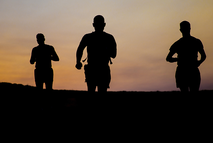 Image of U.S. Marines participate in morning physical training during a field exercise at Marine Corps Base Camp Pendleton, California. (Photo Courtesy: U.S. Marine Corps).