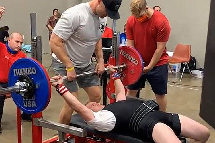 Image of 4_man bench pressing.