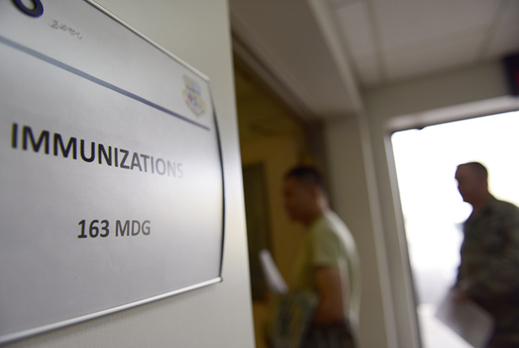 Image of U.S. Air Force Airmen of the 163d Attack Wing line up to  receive a flu vaccine at March Air Reserve Base, California, Nov. 4, 2018. The flu vaccine is an annual requirement for military members to help curb the spread of the flu and limit its impact within the unit. (U.S. Air National Guard photo by Tech. Sgt. Julianne M. Showalter).