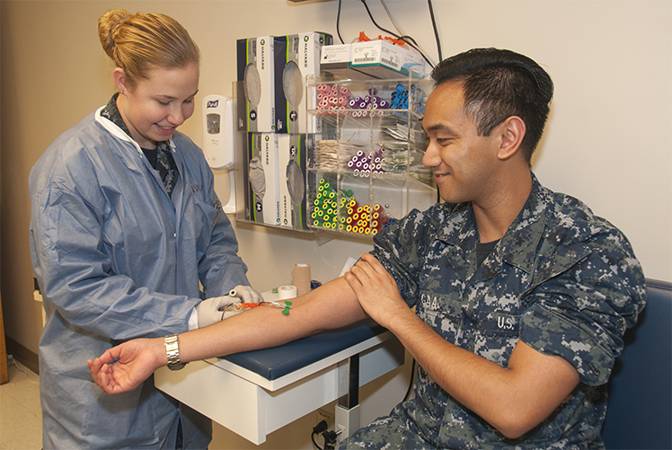 Image of A hospitalman draws blood at Naval Medical Center Portsmouth’s Laboratory Department. DoD Photo.