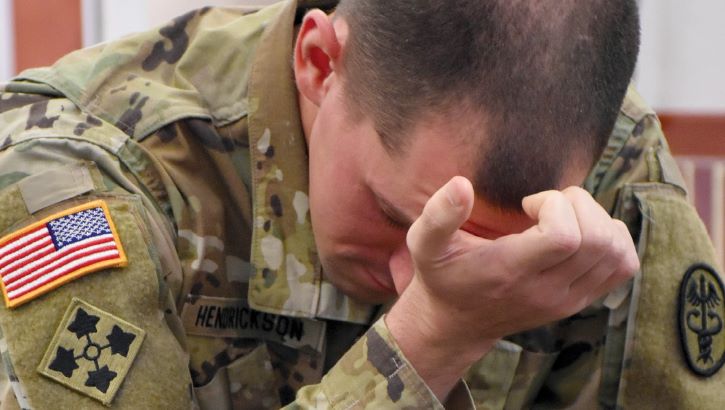 Image of Soldier with head in hand.