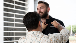 U.S. Air Force Staff Sgt. Austin Lawhon, 59th Medical Wing paramedic, receives an EMS Field Save Pin from his mentor and former active-duty paramedic, Adam Tellez