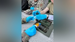 Tech. Sgt. Jazzmin Tristan, a Public Health technician with the 168th Wing, Alaska Air National Guard, and her Air National Guard counterparts test a water sample for potential biological and chemical hazards during field training at Alpena Combat Readiness Training Center