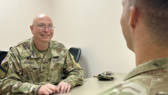 Military chaplain chats with Solder during a wellness check