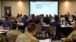 Trisha Kearns, program coordinator for the Army Community Service Exceptional Family Member Program, addresses nearly 95 regional hospital executives, local leaders, elected officials and military service members during the Bayne-Jones Army Community Hospital key leader engagement, Jan. 9 at the Joint Readiness Training Center and Fort Johnson, Louisiana. (Photo: Jean Graves) 