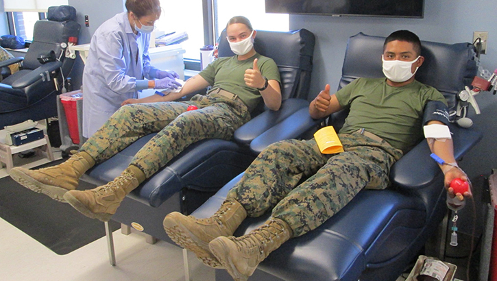 Image of Military personnel donating blood.