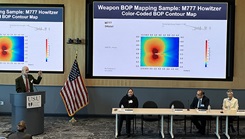 USU scientists Dr. Paul Pasquina, Navy Cmdr. (Dr.) Kent Werner, and Dr. Jeff Leggit sitting in front of a screen