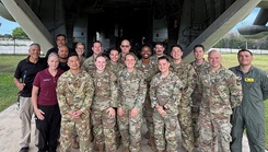 Members of the U.S. Army Institute of Surgical Research Burn Flight Team pose for a group photo with members of the U.S. Air Force’s 59th Medical Wing during a training exercise. (Photo By Steven Galvan)
