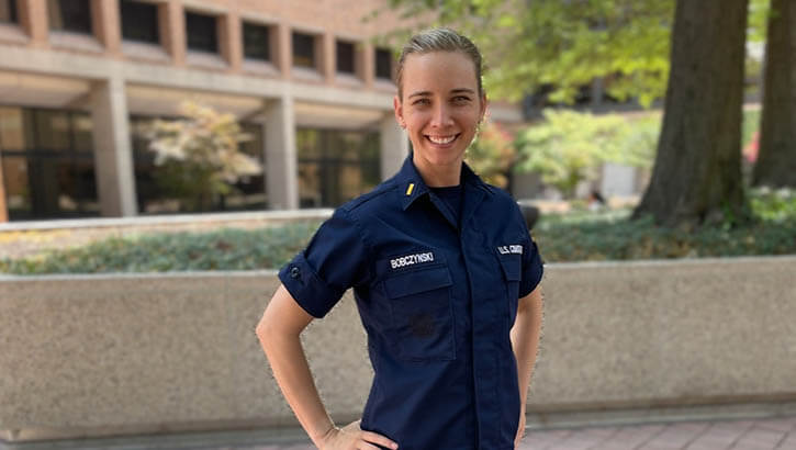 Image of US Coast Guard Ensign Bobczynski smiles at camera.