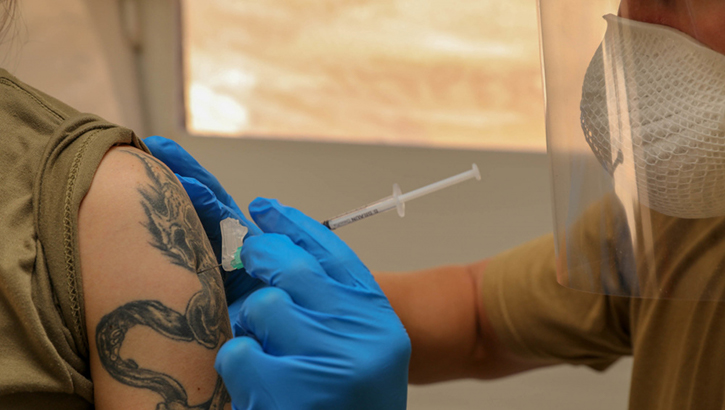 Image of A soldier gets a shot in the arm.