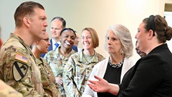 Col. Patrick W. Miller, commander of Bayne-Jones Army Community Hospital, speaks with Whitney Albright and Donna Howe, field representatives for U.S. House Speaker Mike Johnson, R-La.