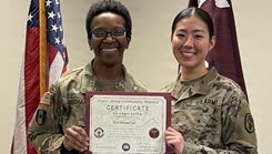 2nd Lt. Dawon Lee, an Army Nurse assigned to Evans Army Community Hospital, receives a graduation certificate from Col. Cynthia Buchanan, the EACH Deputy Commander for Nursing, during the Clinical Nurse Transition Program graduation ceremony.