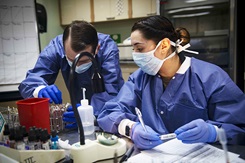 Navy Petty Officer 2nd Class Cecil Dorse, left, and Navy Petty Officer 3rd Class Janet Rosas test blood samples aboard the Military Sealift Command hospital ship USNS Comfort while the ship is in New York City in support of the nation’s COVID-19 response, April 6, 2020. Photo By: Navy Petty Officer 2nd Class Sara Eshleman