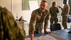 U.S. Air Force Maj. Kolby Parent, The United States Air Forces in Europe - Air Forces Africa Office of the Command Surgeon international health specialist, speaks with Croatian army medical personnel during a global health engagement