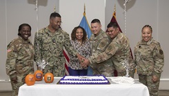 U.S. Army Lt. Gen. Telita Crosland, director of the Defense Health Agency, poses with U.S. Navy Petty Officer 2nd Class Billy Clay Jr.; Natalie Noland, DHA; U.S. Air Force Tech. Sgt. Robert Camacho, U.S. Army Master Sgt. Roberto Jerome Jr., and U.S. Air Force Command Chief Master Sgt. Tanya Johnson, DHA senior enlisted leader