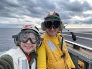 Ship’s Senior Medical Officer works with flight deck members during carrier operations