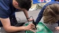 A physician assistant teaches ultrasound to children. 