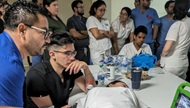 A physician teaches ultrasound to a group of Honduran physicians. 