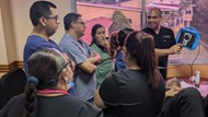 A physician gives a lecture on ocular ultrasound to a group of Honduran physicians. 