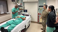 Cytopathology faculty demonstrates how to use the ultrasound machine during a simulated patient encounter at the bedside in the Simulation Laboratory. 