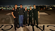 Emergency medicine resident physicians on helipad of Level I trauma center.