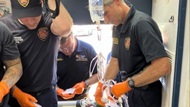 Fellow and firefighters administer prehospital whole blood to a critically ill patient.