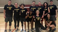 A group of Hematology Medical Oncology fellows and faculty are playing a game of volleyball. 