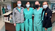 A wards team poses on the floor of their unit. 