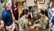 A neonatologist and respiratory therapist teach neonatal transport team members about oxygen tubing and ventilation on transport. 