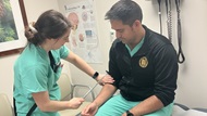 SAUSHEC Neurology resident teaches a rotating resident how to elicit a biceps reflex. 