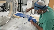 Interventional radiologist simulates the steps for Y-90 radioembolization therapy as part of combined Interventional Radiology / radiation safety training. 