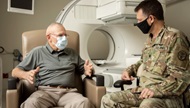 U.S. Army Lt. Col. Nathan McWhorter, chief of Nuclear Medicine, consults with patient, Harold G. Overstreet, retired Sgt. Maj. of the Marine Corps at Brooke Army Medical Center, Fort Sam Houston, Texas, Sept. 27, 2022. Overstreet is undergoing a new treatment for prostate cancer patients which is combined with a specific type of positron emission tomography (PET) imaging agent for prostate cancer. The PET imaging allows the doctor to see where the cancer is located as well as the extent of metastasis. The new FDA-approved prostate-specific membrane antigen (PSMA) PET imaging scan significantly improves prostate cancer detection and treatment.