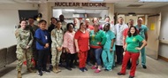 Nuclear Medicine department holiday photo with physicians, technologists, and pharmacists. 