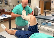 An Orthopaedic PGY1 resident practices applying a lower extremity splint during intern boot camp 2023. 