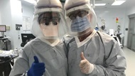 Two Otolaryngology residents pose in the operating room after a procedure.