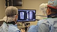 Fellow performs spinal cord stimulator trial with an attending physician.