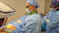 Fellow performing spinal cord stimulator trial with attending. 